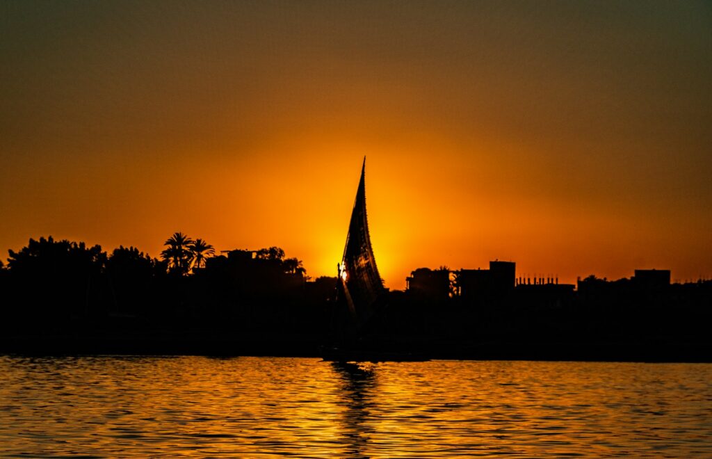 A felucca silhouetted against the sunset on the Nile