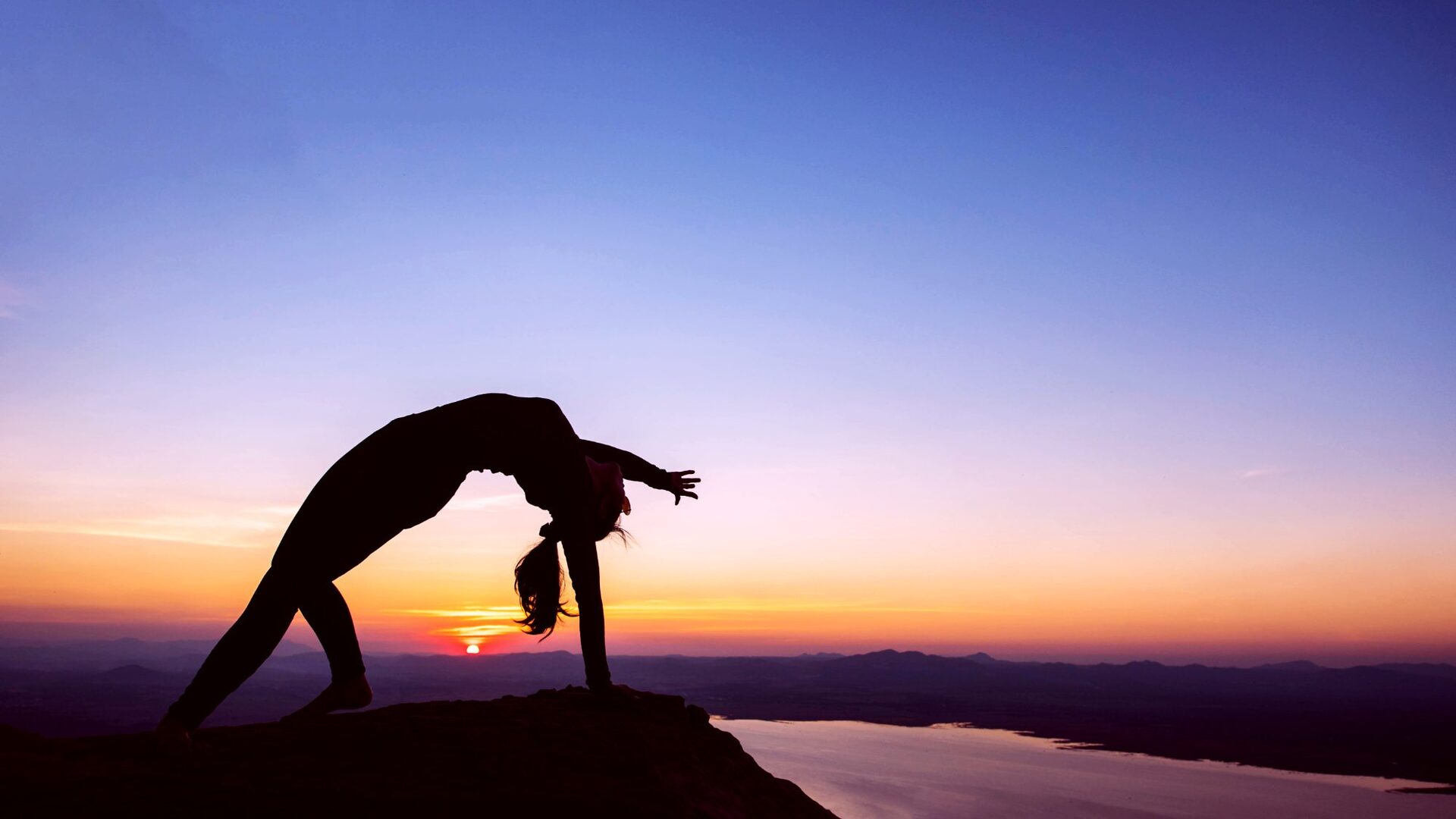Yoga silhouette at sunset over the Teruel landscape